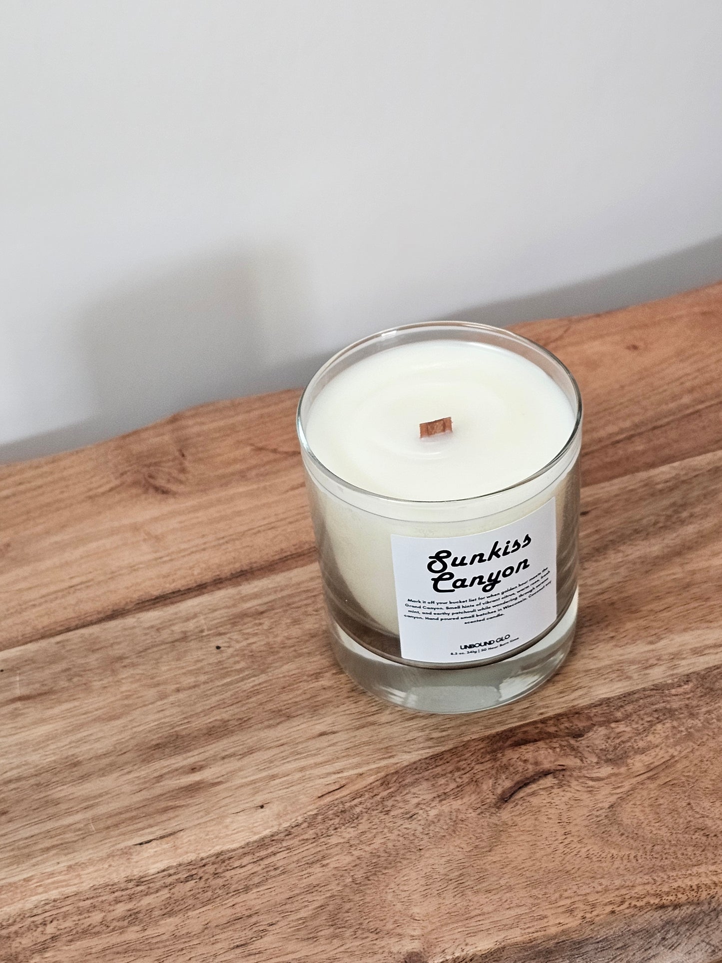Grand canyon candle that smells like the grand canyon being kissed by the sun with notes of citrus, black pepper, rose, patchouli, and vanilla.